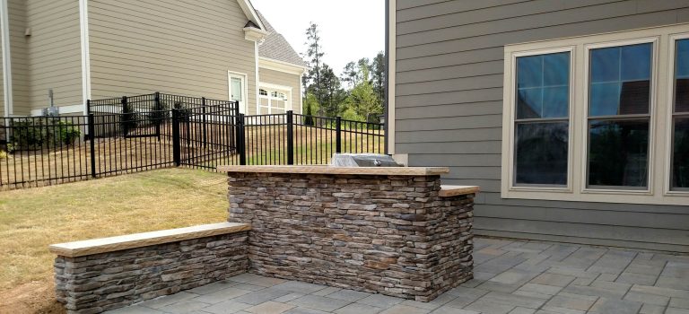 Inspiration for a mid-sized modern backyard concrete paver patio kitchen remodel in Raleigh with a gazebo