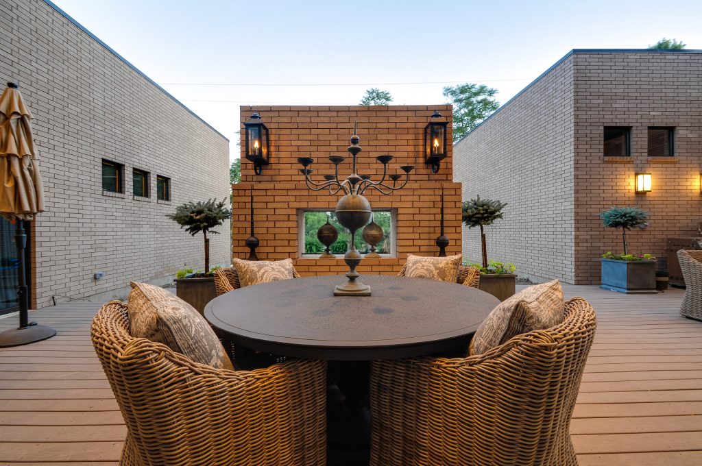 Inspiration for a mid-sized modern backyard deck remodel in Dallas with a roof extension