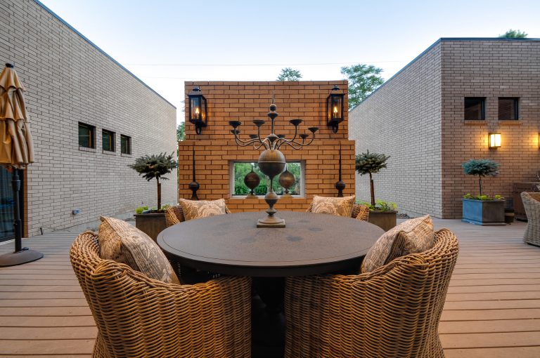 Inspiration for a mid-sized modern backyard deck remodel in Dallas with a roof extension