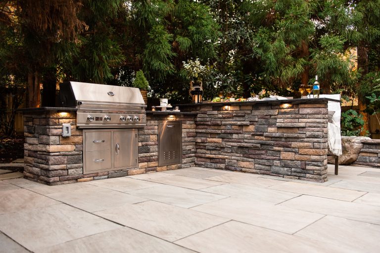 Inspiration for a mid-sized modern backyard stone patio kitchen remodel in Richmond