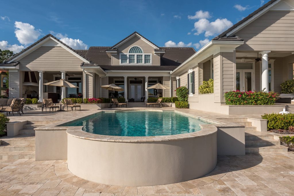 Inspiration for a mid-sized modern backyard tile and custom-shaped aboveground pool remodel in Orlando