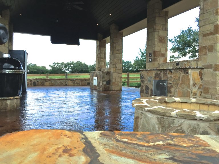 Inspiration for a mid-sized rustic backyard concrete patio kitchen remodel in Austin with a gazebo