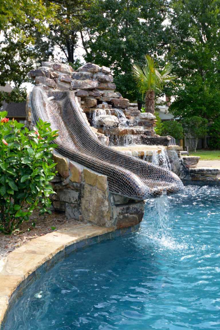 Inspiration for a mid-sized rustic backyard custom-shaped and stone lap water slide remodel in Little Rock