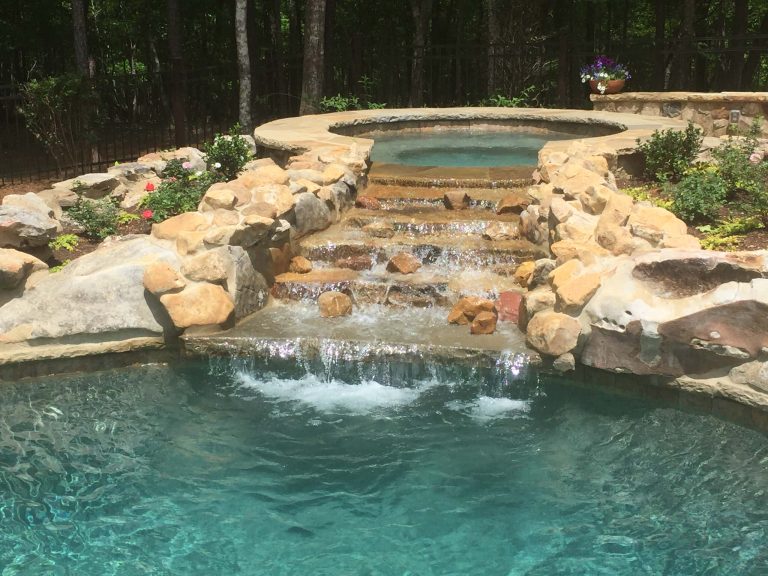 Inspiration for a mid-sized rustic backyard stone and custom-shaped natural hot tub remodel in Atlanta