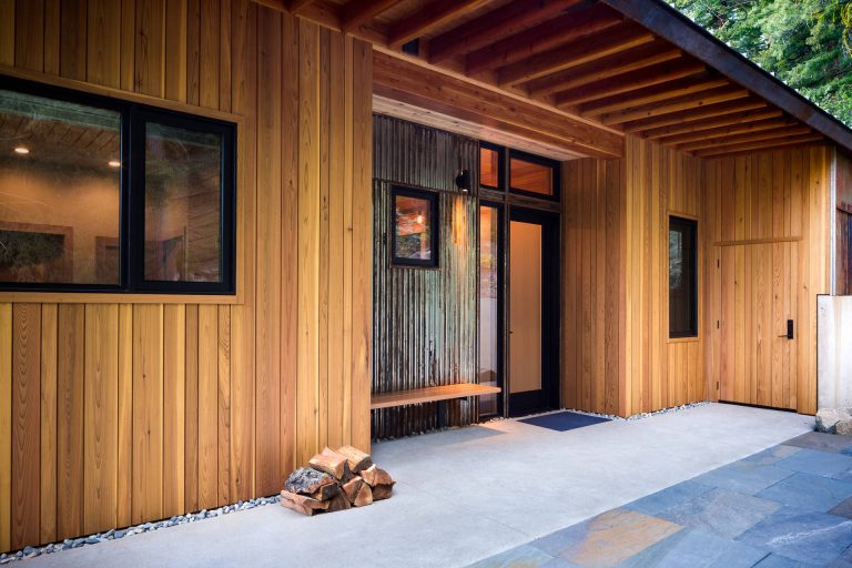 Inspiration for a mid-sized rustic concrete front porch remodel in Seattle with a roof extension by Johnston Architects | Outdoor Photos | Porch | Landscaping | Landscape Design | Outdoor Living Space | Porch Design Ideas | Outdoor Living Space Ideas | Backyard Design
