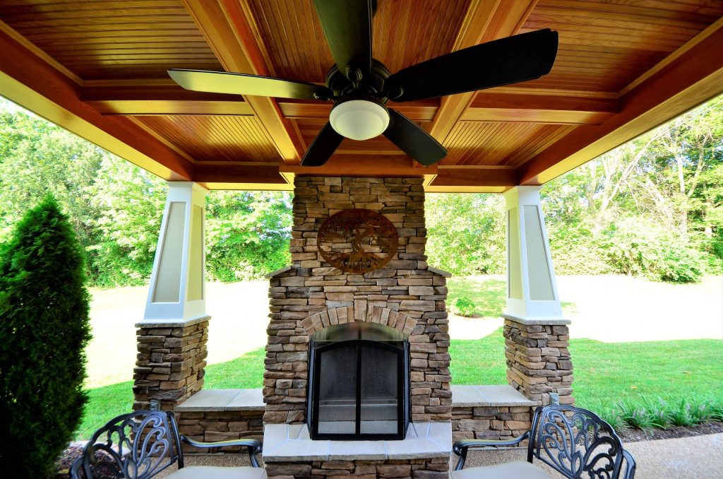 Inspiration for a mid-sized rustic stamped concrete back porch remodel in St Louis with a fire pit and a roof extension by Al Droste & Sons Construction Company | Outdoor Photos | Porch | Landscaping | Landscape Design | Outdoor Living Space | Porch Design Ideas | Outdoor Living Space Ideas | Backyard Design