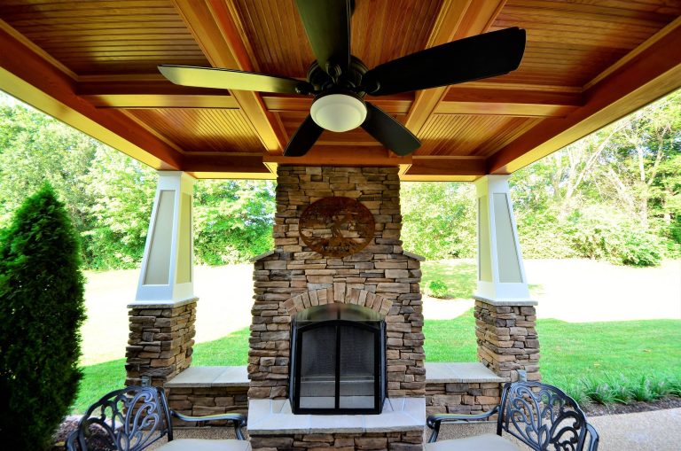 Inspiration for a mid-sized rustic stamped concrete back porch remodel in St Louis with a fire pit and a roof extension by Al Droste & Sons Construction Company | Outdoor Photos | Porch | Landscaping | Landscape Design | Outdoor Living Space | Porch Design Ideas | Outdoor Living Space Ideas | Backyard Design