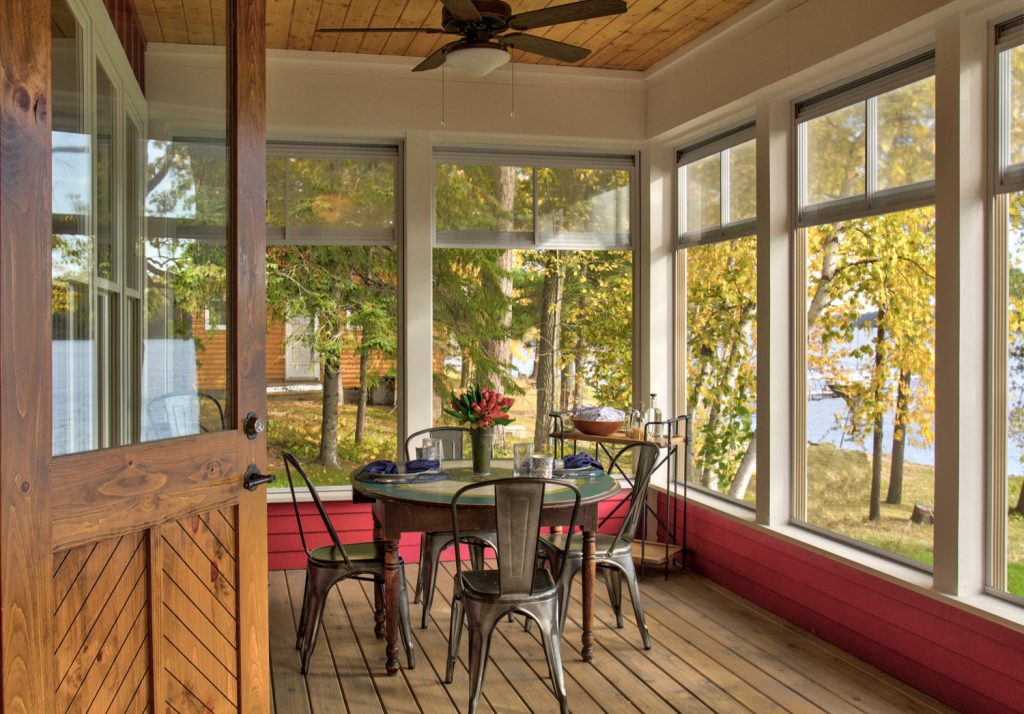 Inspiration for a mid-sized scandinavian screened-in back porch remodel in Minneapolis with decking and a roof extension by Lands End Development - Designers & Builders | Outdoor Photos | Porch | Landscaping | Landscape Design | Outdoor Living Space | Porch Design Ideas | Outdoor Living Space Ideas | Backyard Design