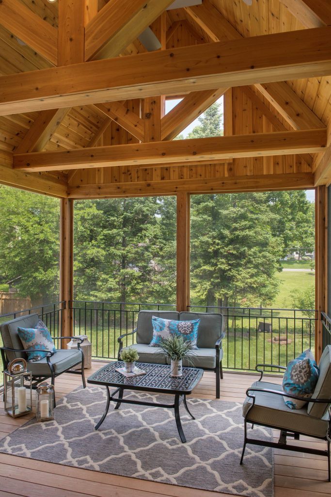 Inspiration for a mid-sized screened-in back porch remodel in Minneapolis with decking and an awning by OSLO Builders | Outdoor Photos | Porch | Landscaping | Landscape Design | Outdoor Living Space | Porch Design Ideas | Outdoor Living Space Ideas | Backyard Design