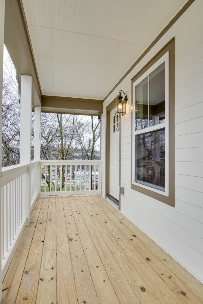 Inspiration for a mid-sized timeless back porch remodel in Nashville with decking and a roof extension by White Pines Building Group | Outdoor Photos | Porch | Landscaping | Landscape Design | Outdoor Living Space | Porch Design Ideas | Outdoor Living Space Ideas | Backyard Design
