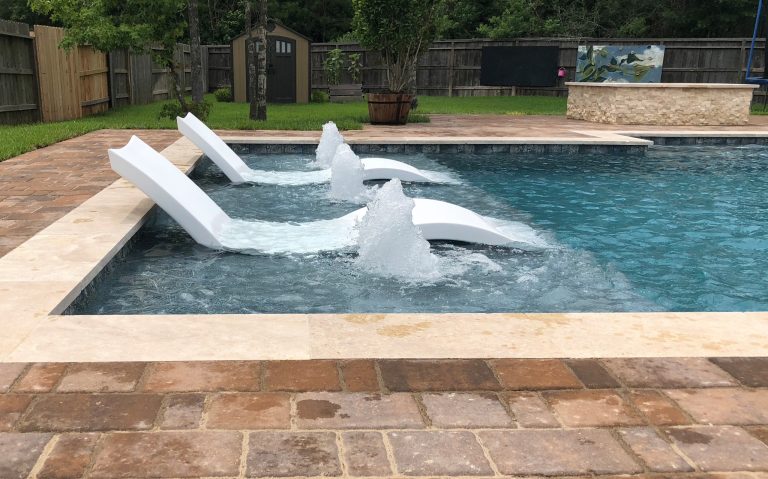 Inspiration for a mid-sized timeless backyard brick and rectangular lap hot tub remodel in Houston