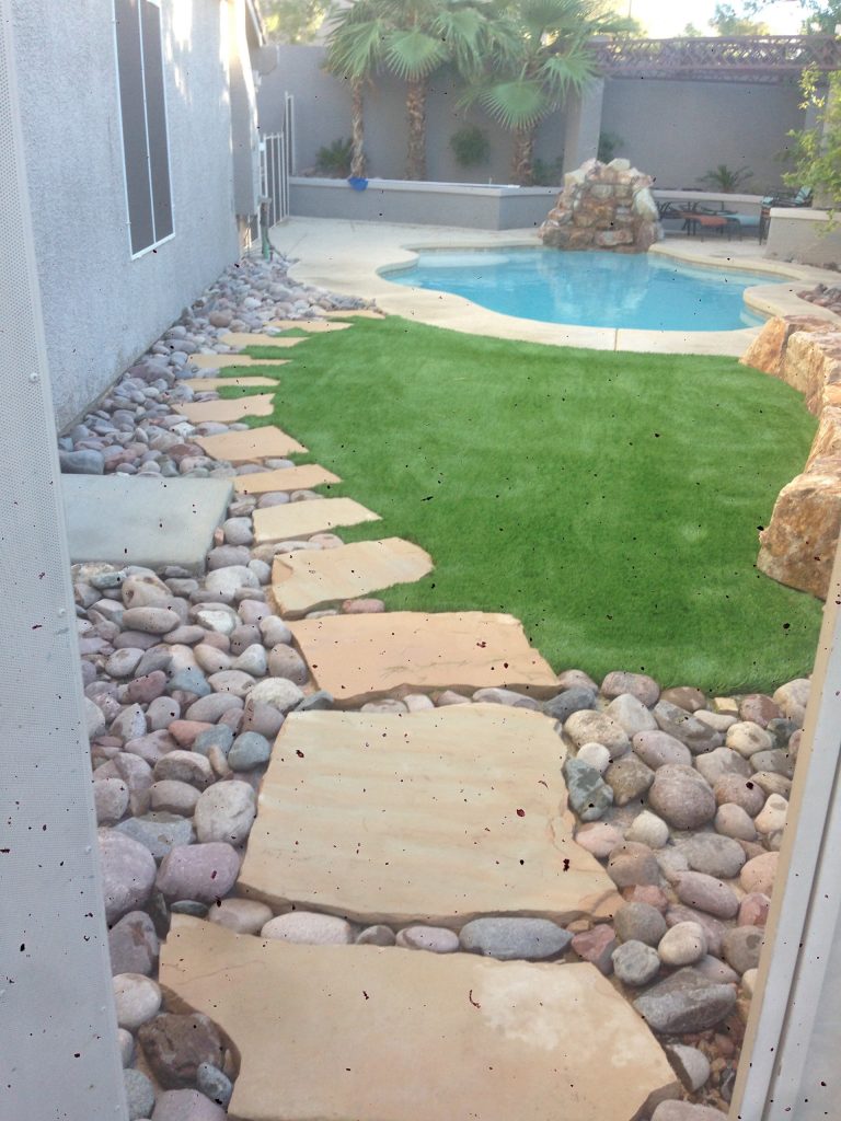 Inspiration for a mid-sized timeless backyard concrete and custom-shaped lap pool remodel in Las Vegas
