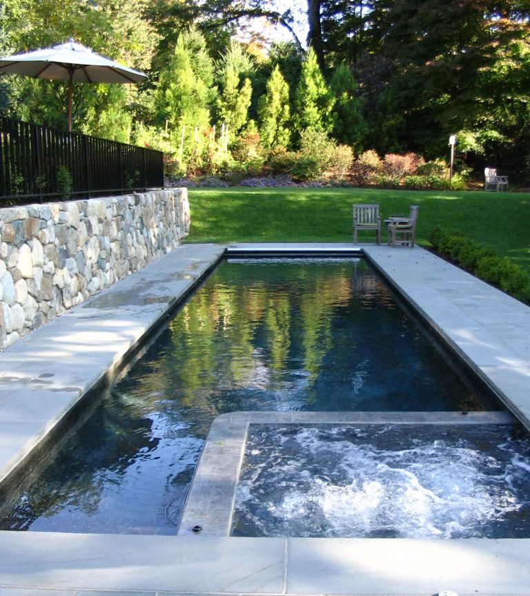 Inspiration for a mid-sized timeless backyard concrete paver and rectangular pool remodel in Boston