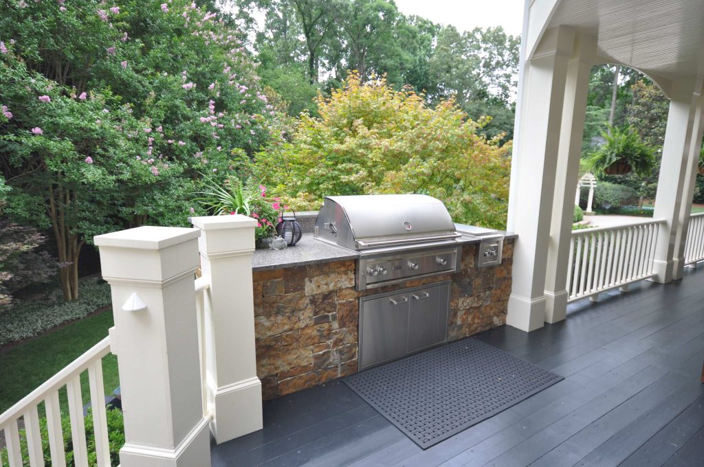 Inspiration for a mid-sized timeless backyard outdoor kitchen deck remodel in Raleigh with no cover