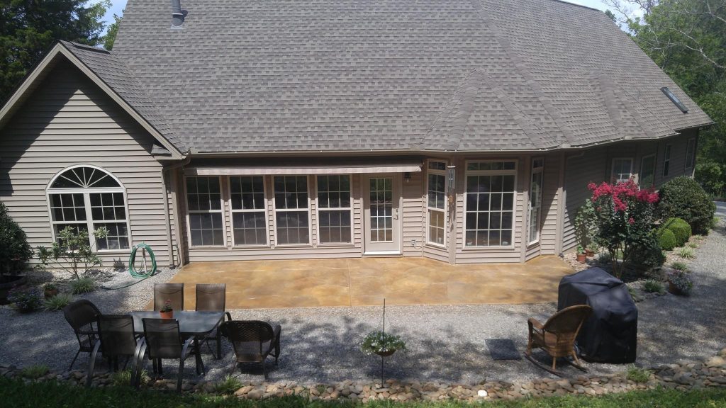 Inspiration for a mid-sized timeless backyard stamped concrete patio kitchen remodel in Other with no cover