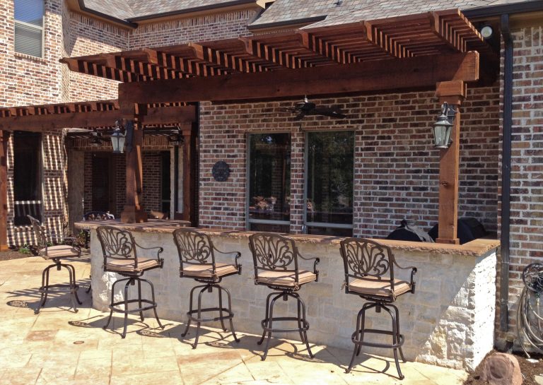 Inspiration for a mid-sized timeless backyard tile patio kitchen remodel in Dallas with a pergola