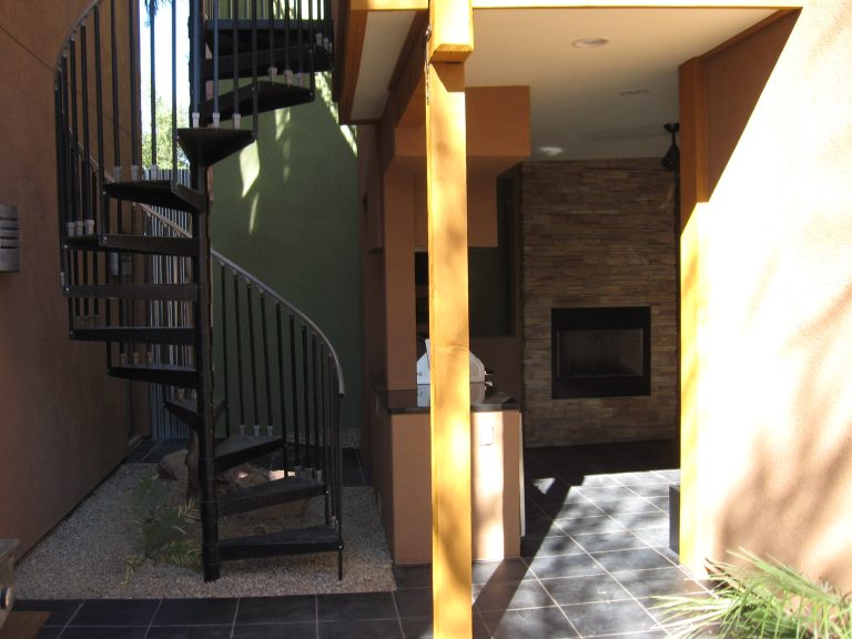Inspiration for a mid-sized timeless backyard tile patio kitchen remodel in Phoenix with a roof extension