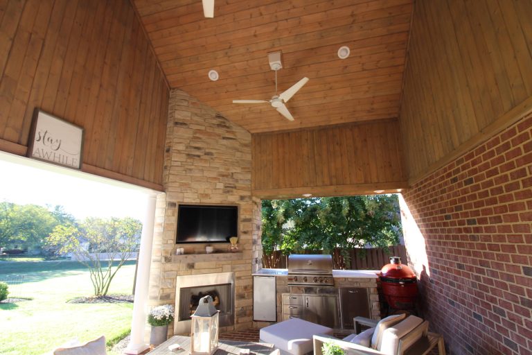 Inspiration for a mid-sized timeless brick porch remodel in Other with a roof extension