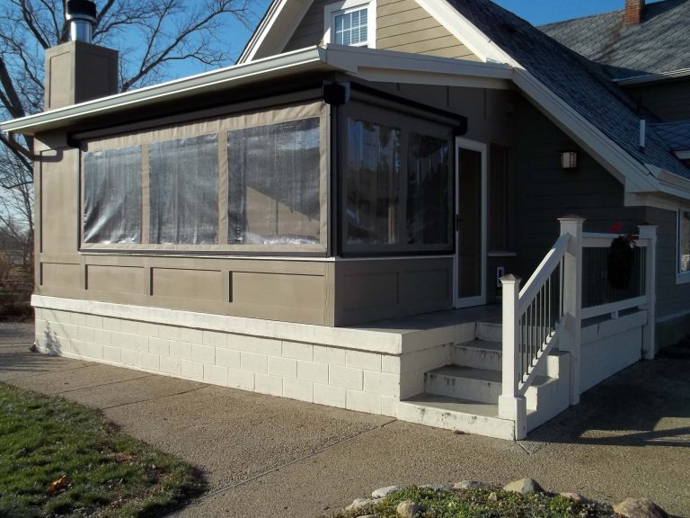 Inspiration for a mid-sized timeless concrete back porch remodel in Indianapolis with a roof extension by Shade By Design | Outdoor Photos | Porch | Landscaping | Landscape Design | Outdoor Living Space | Porch Design Ideas | Outdoor Living Space Ideas | Backyard Design