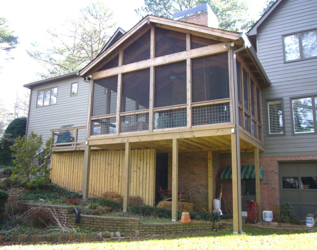 Inspiration for a mid-sized timeless screened-in back porch remodel in Atlanta with a roof extension by Synergy Outdoor | Outdoor Photos | Porch | Landscaping | Landscape Design | Outdoor Living Space | Porch Design Ideas | Outdoor Living Space Ideas | Backyard Design