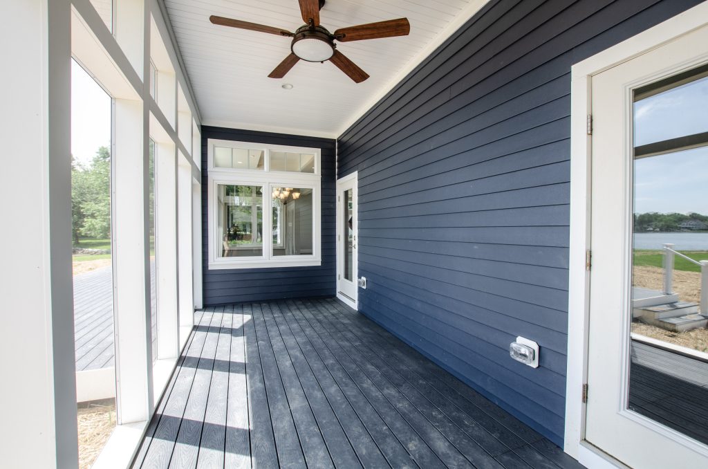 Inspiration for a mid-sized timeless screened-in front porch remodel in Baltimore with decking and a roof extension by Zander Homes | Outdoor Photos | Porch | Landscaping | Landscape Design | Outdoor Living Space | Porch Design Ideas | Outdoor Living Space Ideas | Backyard Design