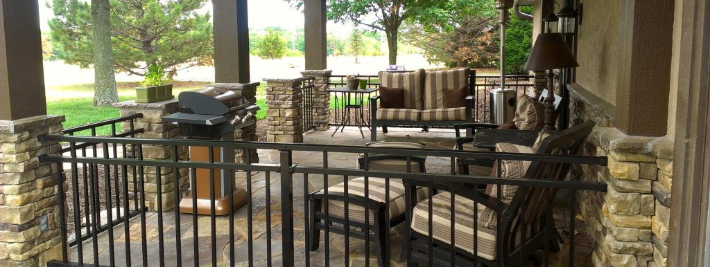 Inspiration for a mid-sized timeless stone front porch remodel in Kansas City with a roof extension by Allen Building Specialties, Inc. | Outdoor Photos | Porch | Landscaping | Landscape Design | Outdoor Living Space | Porch Design Ideas | Outdoor Living Space Ideas | Backyard Design