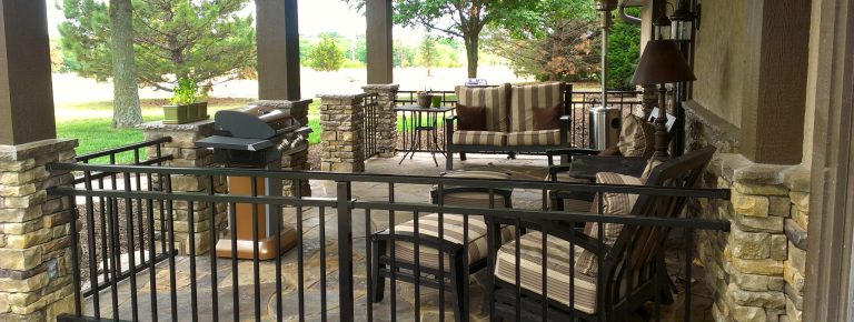 Inspiration for a mid-sized timeless stone front porch remodel in Kansas City with a roof extension by Allen Building Specialties, Inc. | Outdoor Photos | Porch | Landscaping | Landscape Design | Outdoor Living Space | Porch Design Ideas | Outdoor Living Space Ideas | Backyard Design