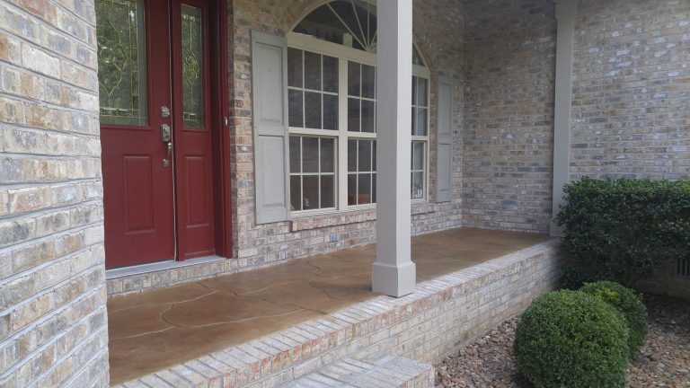 Inspiration for a mid-sized timeless stone front porch remodel in Other with a roof extension by Custom Concrete & Design, LLC | Outdoor Photos | Porch | Landscaping | Landscape Design | Outdoor Living Space | Porch Design Ideas | Outdoor Living Space Ideas | Backyard Design