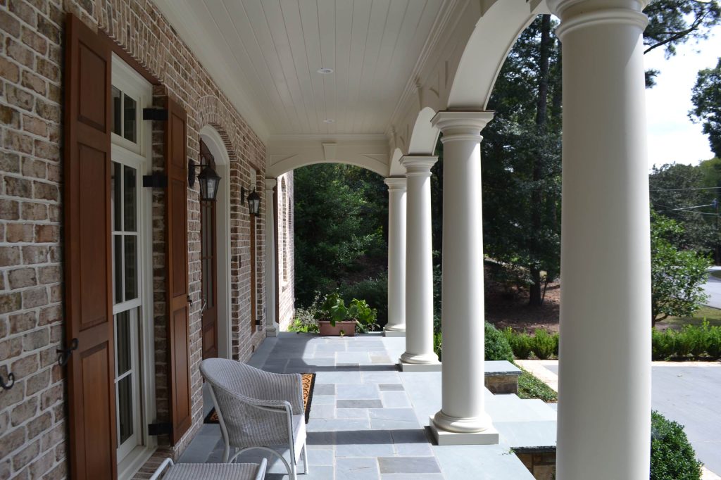 Inspiration for a mid-sized timeless tile front porch remodel in Atlanta with a roof extension by RGROVE Design Studio, Inc. | Outdoor Photos | Porch | Landscaping | Landscape Design | Outdoor Living Space | Porch Design Ideas | Outdoor Living Space Ideas | Backyard Design
