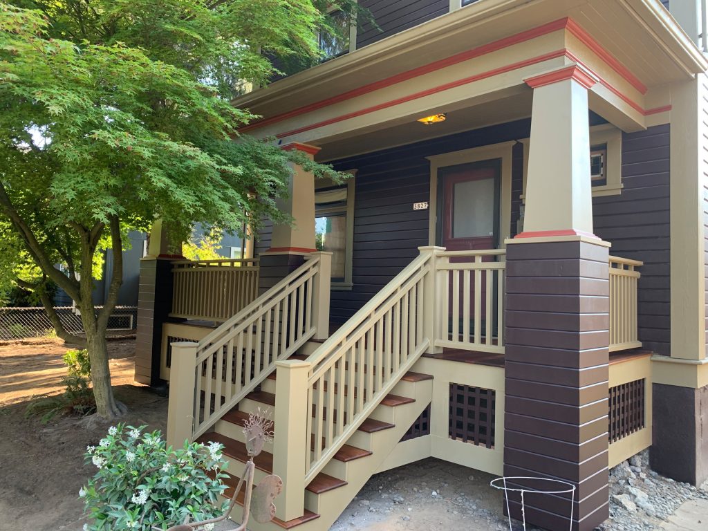 Inspiration for a mid-sized timeless wood railing front porch remodel in Portland with a roof extension by Porch Masters | Outdoor Photos | Porch | Landscaping | Landscape Design | Outdoor Living Space | Porch Design Ideas | Outdoor Living Space Ideas | Backyard Design