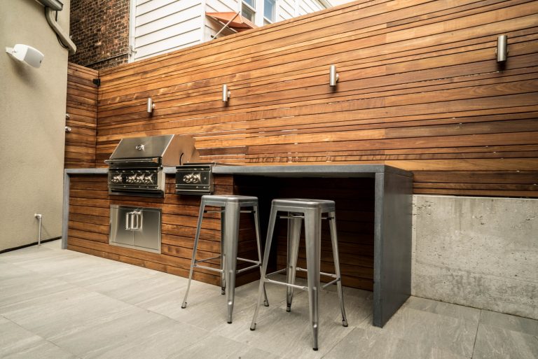 Inspiration for a mid-sized transitional backyard tile patio kitchen remodel in Orange County with no cover