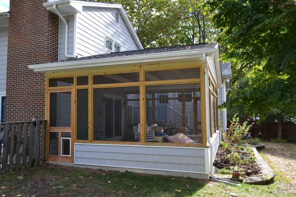 Inspiration for a mid-sized transitional concrete screened-in back porch remodel in Baltimore with a roof extension by KB Lueck Building Consultants, LLC. | Outdoor Photos | Porch | Landscaping | Landscape Design | Outdoor Living Space | Porch Design Ideas | Outdoor Living Space Ideas | Backyard Design