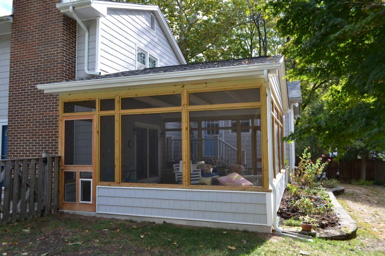 Inspiration for a mid-sized transitional concrete screened-in back porch remodel in Baltimore with a roof extension by KB Lueck Building Consultants, LLC. | Outdoor Photos | Porch | Landscaping | Landscape Design | Outdoor Living Space | Porch Design Ideas | Outdoor Living Space Ideas | Backyard Design