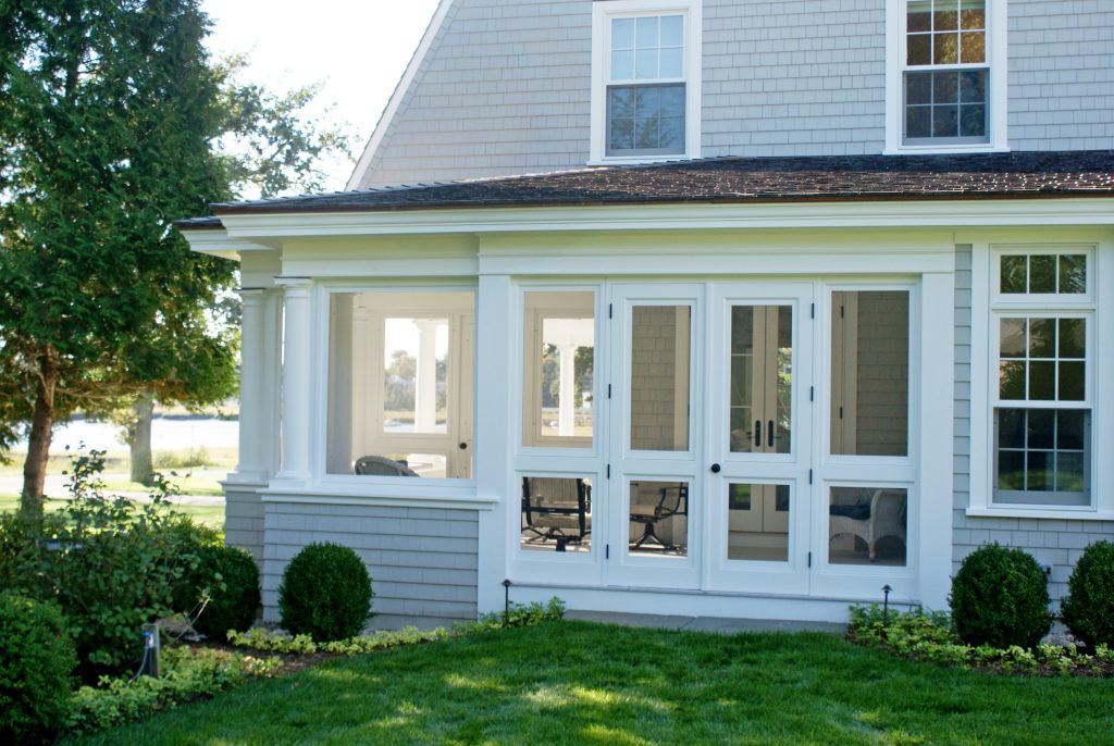 Inspiration for a mid-sized transitional screened-in side porch remodel in Boston with decking and a roof extension by Julia Chuslo Architects | Outdoor Photos | Porch | Landscaping | Landscape Design | Outdoor Living Space | Porch Design Ideas | Outdoor Living Space Ideas | Backyard Design