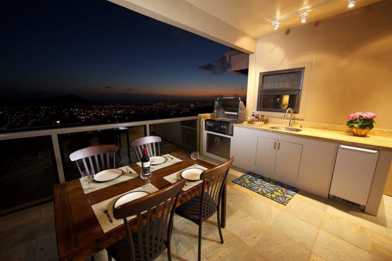 Inspiration for a mid-sized tropical backyard outdoor kitchen deck remodel in Hawaii with a roof extension