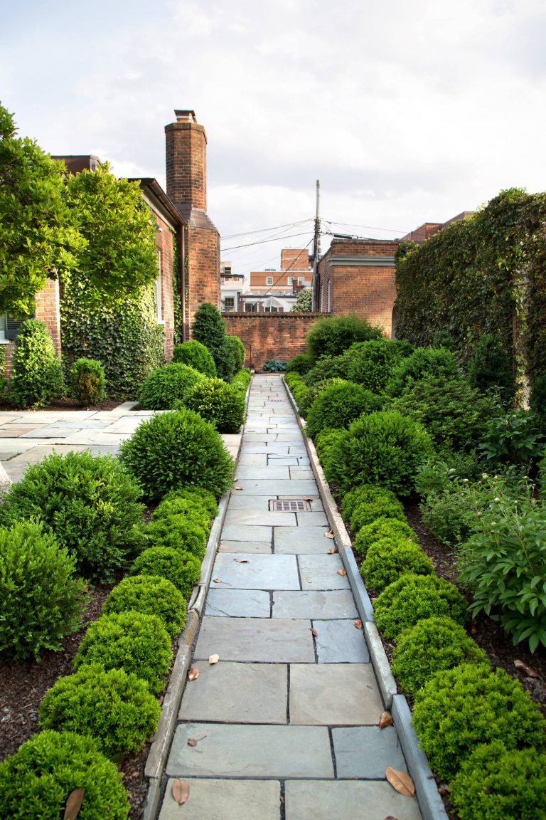 Inspiration for a mid-sized traditional full sun backyard brick formal garden in DC Metro.
