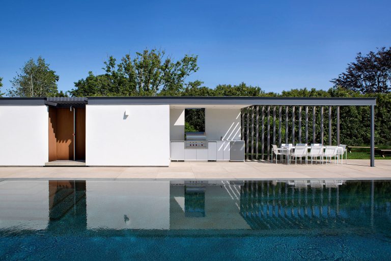 Inspiration for a modern backyard patio kitchen remodel in New York with a roof extension