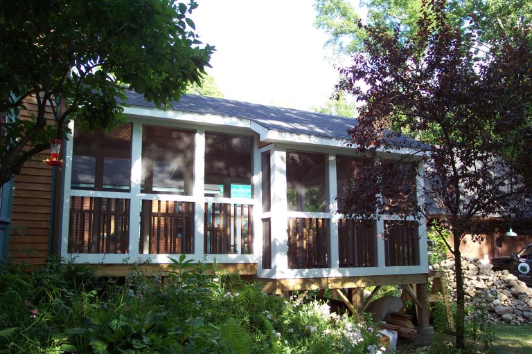 Inspiration for a modern screened-in front porch remodel in Portland Maine with a roof extension by Great Northern Builders, Inc. | Outdoor Photos | Porch | Landscaping | Landscape Design | Outdoor Living Space | Porch Design Ideas | Outdoor Living Space Ideas | Backyard Design