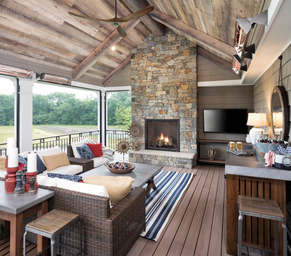 Inspiration for a rustic back porch remodel in Minneapolis with a fireplace, decking and a roof extension by Wooddale Builders | Outdoor Photos | Porch | Landscaping | Landscape Design | Outdoor Living Space | Porch Design Ideas | Outdoor Living Space Ideas | Backyard Design