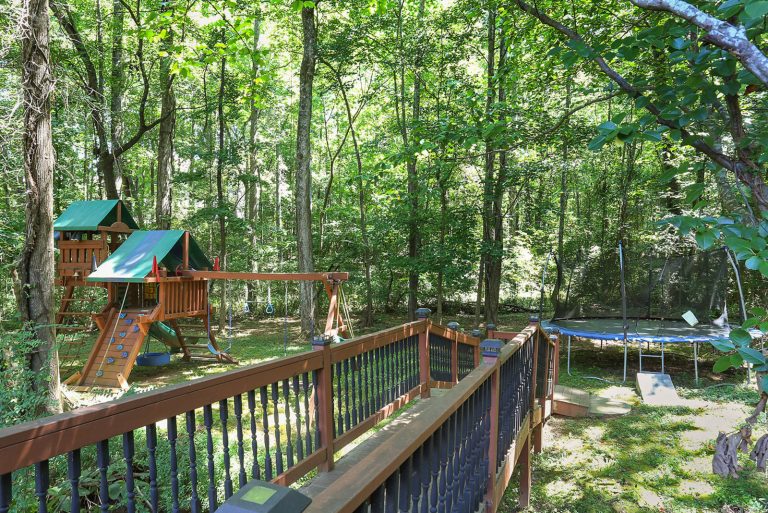 Inspiration for a rustic backyard outdoor playset in Atlanta.