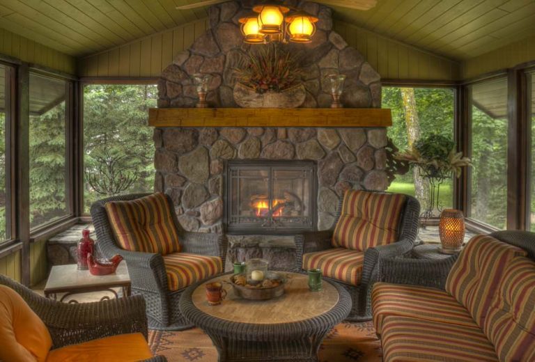 Inspiration for a rustic porch remodel in Minneapolis with a fire pit and a roof extension by Lands End Development - Designers & Builders | Outdoor Photos | Porch | Landscaping | Landscape Design | Outdoor Living Space | Porch Design Ideas | Outdoor Living Space Ideas | Backyard Design