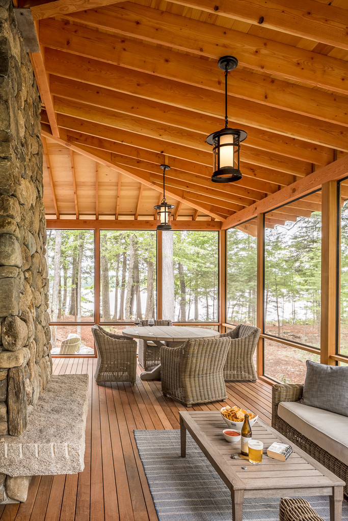 Inspiration for a rustic porch remodel in Portland Maine with decking and a roof extension by R.P. Morrison Builders, Inc. | Outdoor Photos | Porch | Landscaping | Landscape Design | Outdoor Living Space | Porch Design Ideas | Outdoor Living Space Ideas | Backyard Design