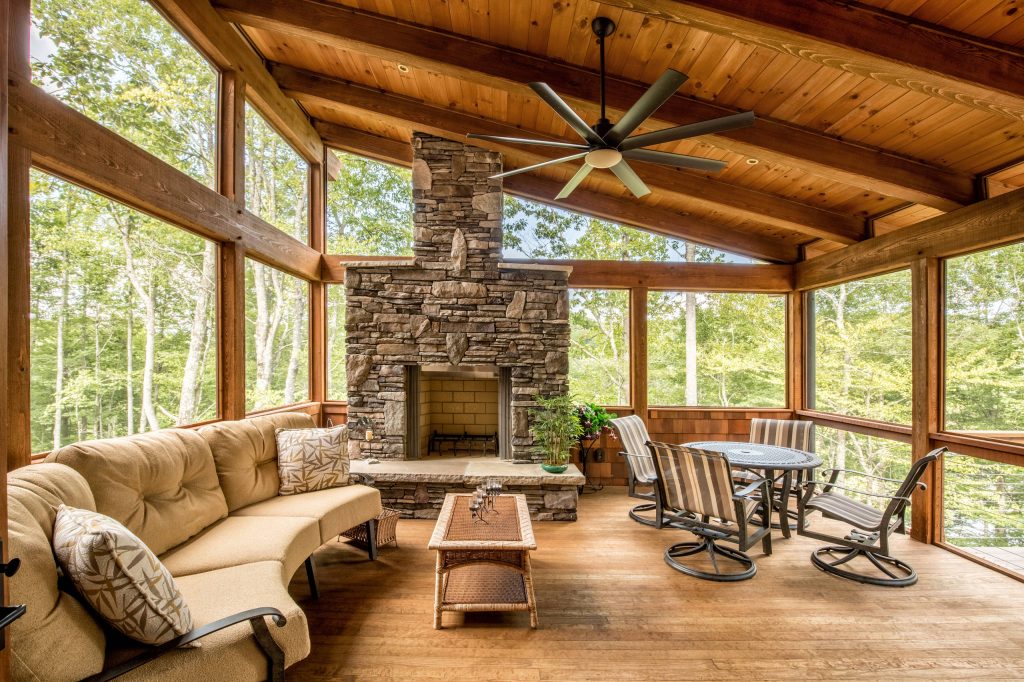 Inspiration for a rustic screened-in porch remodel in Charlotte with decking and a roof extension by Headwaters Enterprises, Inc | Outdoor Photos | Porch | Landscaping | Landscape Design | Outdoor Living Space | Porch Design Ideas | Outdoor Living Space Ideas | Backyard Design