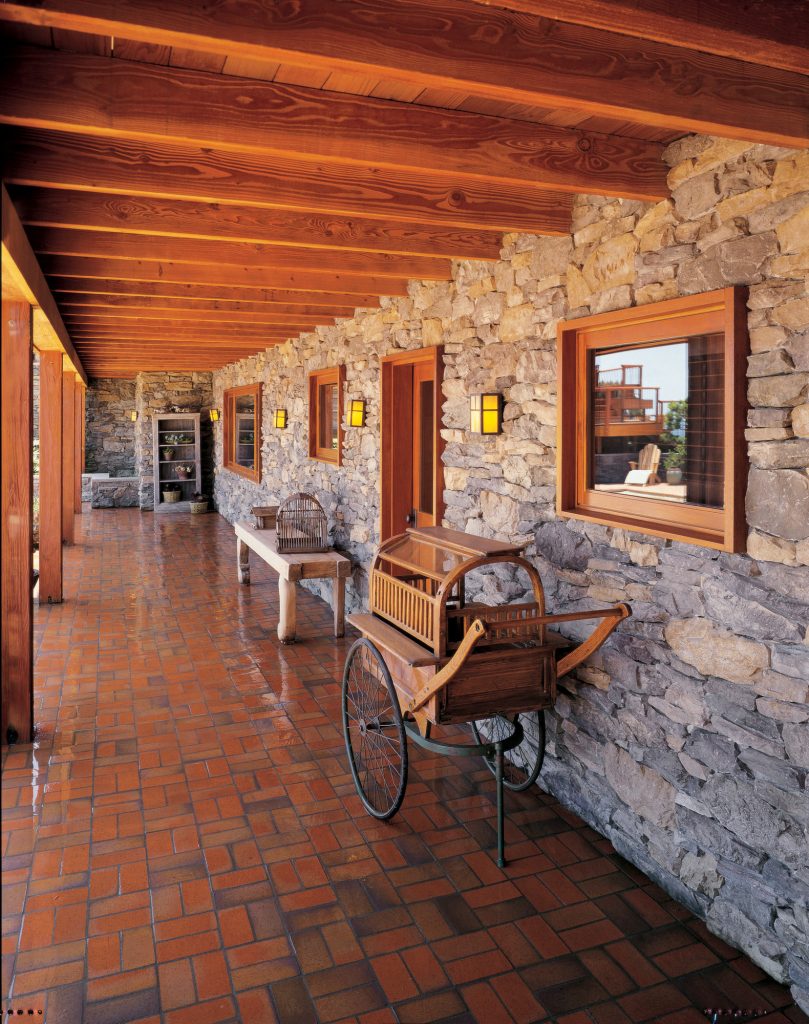 Inspiration for a rustic tile porch remodel in San Diego with a roof extension by Eldorado Stone | Outdoor Photos | Porch | Landscaping | Landscape Design | Outdoor Living Space | Porch Design Ideas | Outdoor Living Space Ideas | Backyard Design