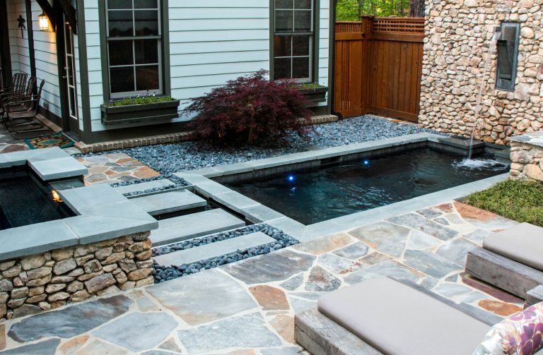 Inspiration for a small backyard custom-shaped pool fountain remodel in Birmingham
