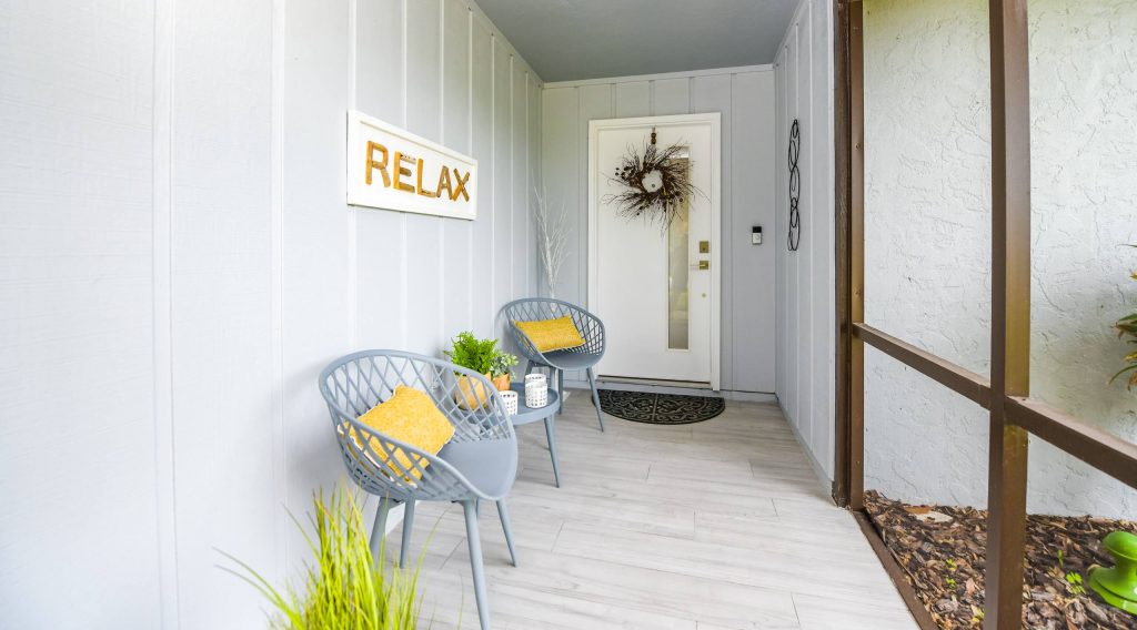 Inspiration for a small modern tile screened-in front porch remodel in Tampa with a roof extension by Queen of Home Staging LLC | Outdoor Photos | Porch | Landscaping | Landscape Design | Outdoor Living Space | Porch Design Ideas | Outdoor Living Space Ideas | Backyard Design