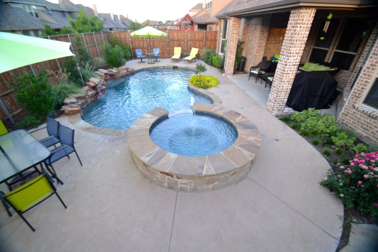 Inspiration for a small rustic backyard custom-shaped pool remodel in Dallas