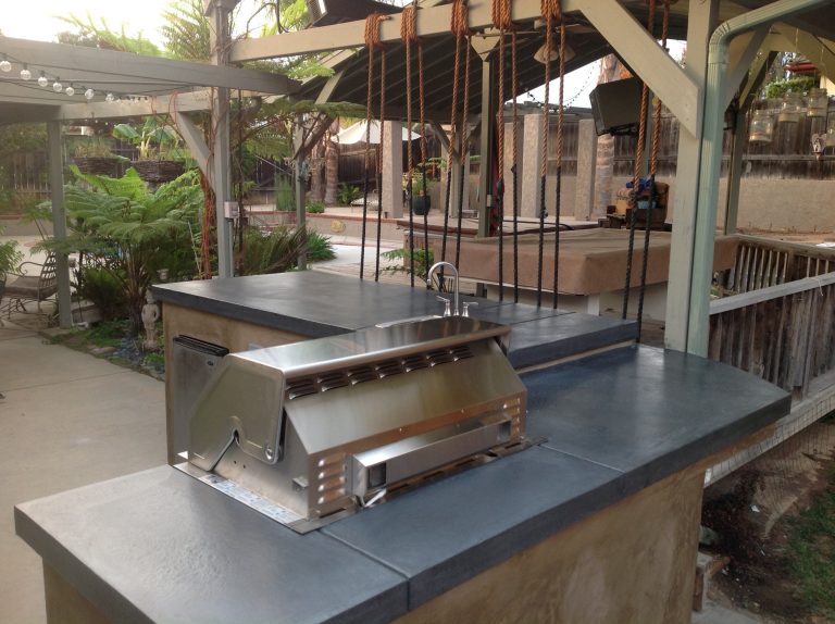 Inspiration for a small timeless backyard concrete paver patio kitchen remodel in Los Angeles with a gazebo