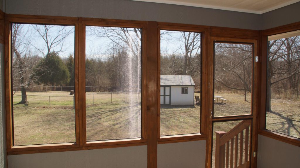 Inspiration for a small timeless screened-in back porch remodel in Other with decking and a roof extension by Winston Brown Remodeling | Outdoor Photos | Porch | Landscaping | Landscape Design | Outdoor Living Space | Porch Design Ideas | Outdoor Living Space Ideas | Backyard Design