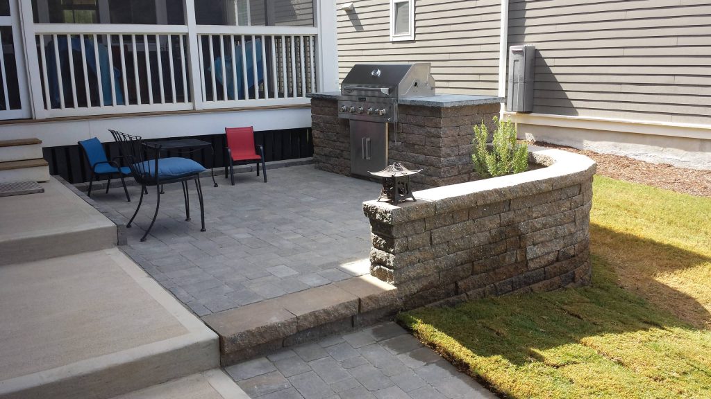 Inspiration for a small transitional front yard concrete paver patio kitchen remodel in Raleigh with no cover